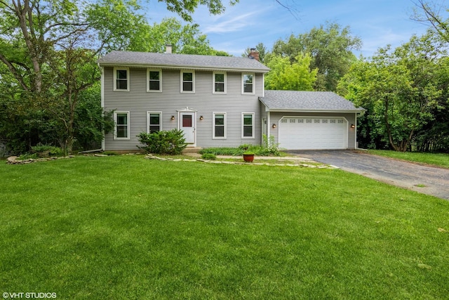 41W058 Colson Dr, Saint Charles, IL 60175 - colonial house featuring driveway, a chimney, a garage, and a front yard