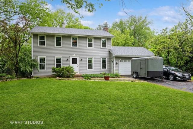 41W058 Colson Dr, Saint Charles, IL 60175 - colonial-style house featuring a garage, a chimney, a front yard, driveway, and a shingled roof