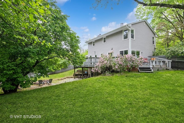 41W058 Colson Dr, Saint Charles, IL 60175 - back of property featuring a deck, an outdoor fire pit, and a chimney