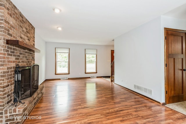 41W058 Colson Dr, Saint Charles, IL 60175 - unfurnished living room featuring wood finished floors, a fireplace, baseboards, and recessed lighting