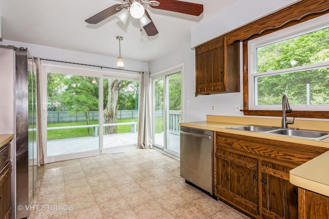 41W058 Colson Dr, Saint Charles, IL 60175 - kitchen featuring appliances with stainless steel finishes, a sink, light countertops, and a ceiling fan