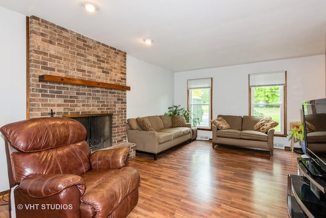 41W058 Colson Dr, Saint Charles, IL 60175 - living area with wood finished floors and a brick fireplace