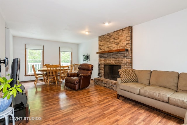 41W058 Colson Dr, Saint Charles, IL 60175 - living room featuring wood finished floors and a brick fireplace