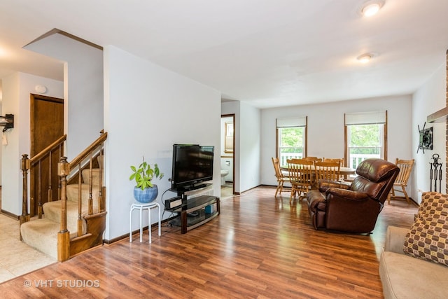 41W058 Colson Dr, Saint Charles, IL 60175 - living room featuring wood finished floors, stairs, and baseboards