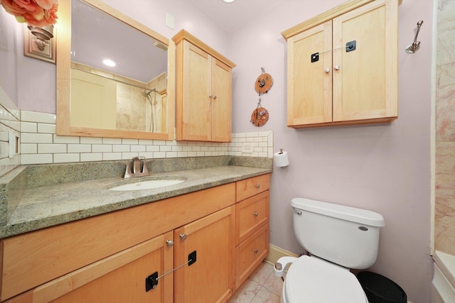 7633 N Greenview Ave Unit 3W, Chicago, IL 60626 - bathroom with toilet, vanity, and decorative backsplash