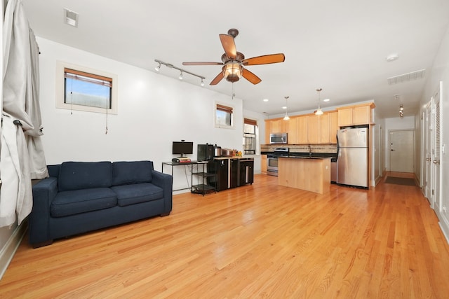 7633 N Greenview Ave Unit 3W, Chicago, IL 60626 - living room with baseboards, visible vents, ceiling fan, and light wood finished floors