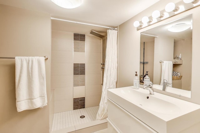 full bath featuring tiled shower, vanity, and a heating unit