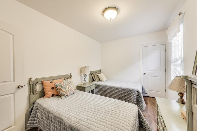 bedroom with wood finished floors