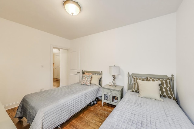 bedroom featuring wood finished floors