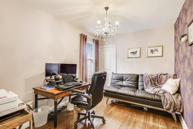 office with an inviting chandelier and wood finished floors