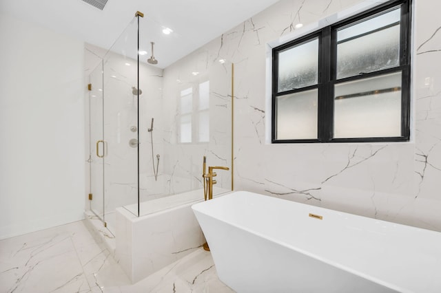 full bathroom with a healthy amount of sunlight, a marble finish shower, a soaking tub, and marble finish floor