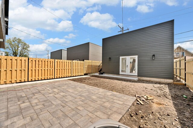 view of patio with a fenced backyard and french doors