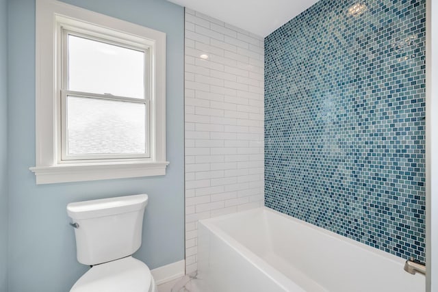 full bath featuring toilet, marble finish floors, baseboards, and  shower combination