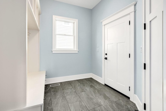mudroom featuring baseboards and marble finish floors