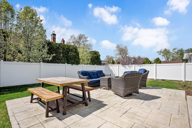 view of patio / terrace featuring outdoor lounge area, outdoor dining space, and a fenced backyard