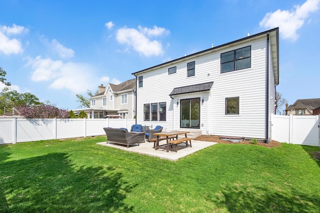 back of property with a patio area and an outdoor hangout area