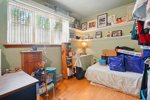 bedroom featuring wood finished floors