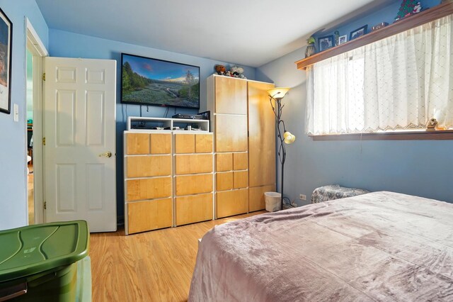 bedroom featuring wood finished floors