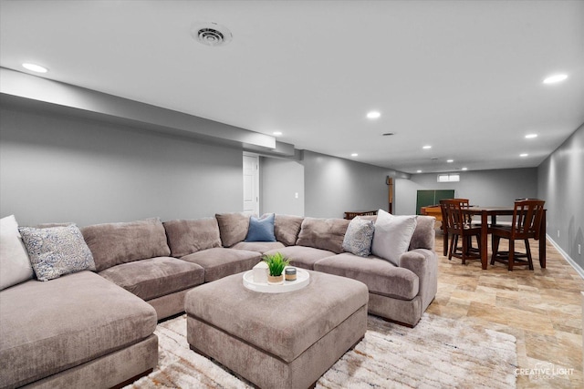 145 W Eisenhower St, Waterman, IL 60556 - living room featuring recessed lighting, stone finish flooring, and visible vents