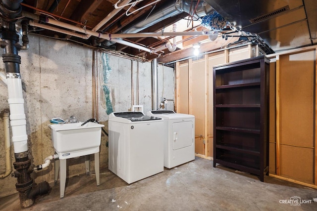 145 W Eisenhower St, Waterman, IL 60556 - unfinished below grade area featuring visible vents, a sink, and washer and dryer