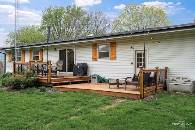 145 W Eisenhower St, Waterman, IL 60556 - rear view of property with a lawn and a deck