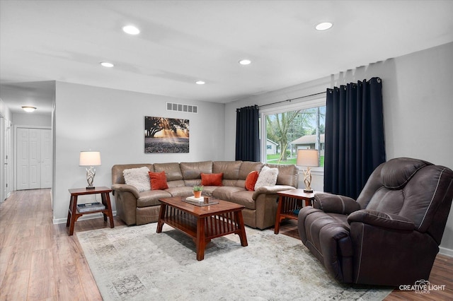 145 W Eisenhower St, Waterman, IL 60556 - living room featuring visible vents, recessed lighting, baseboards, and wood finished floors