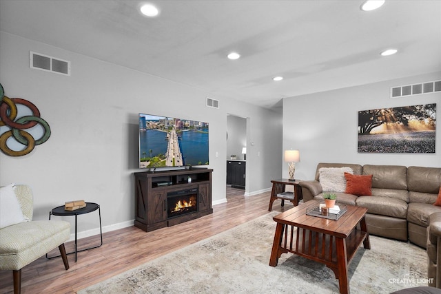 145 W Eisenhower St, Waterman, IL 60556 - living area with recessed lighting, visible vents, and wood finished floors