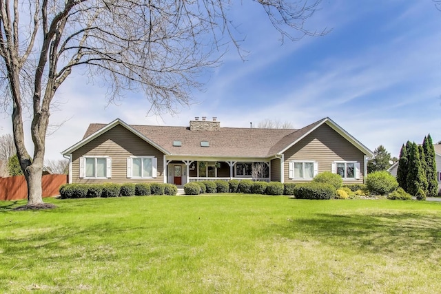 2502 S Hidden Trl, Spring Grove, IL 60081 - view of front of house with fence, a chimney, and a front yard
