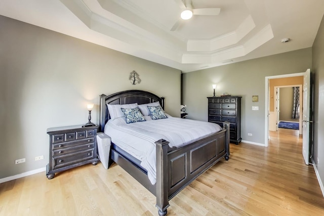 2502 S Hidden Trl, Spring Grove, IL 60081 - bedroom with ceiling fan, a raised ceiling, baseboards, and light wood-style flooring