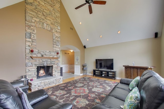 2502 S Hidden Trl, Spring Grove, IL 60081 - living area with wood finished floors, high vaulted ceiling, a fireplace, arched walkways, and ceiling fan