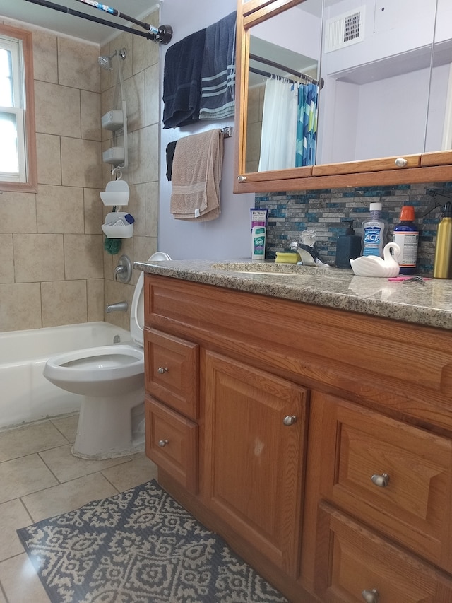 full bath featuring tile patterned flooring, shower / bath combo with shower curtain, toilet, vanity, and visible vents