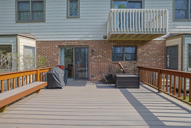 deck featuring a grill