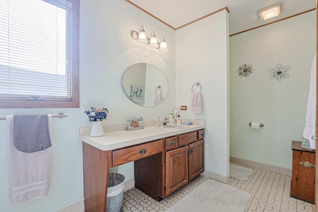 bathroom with vanity and baseboards