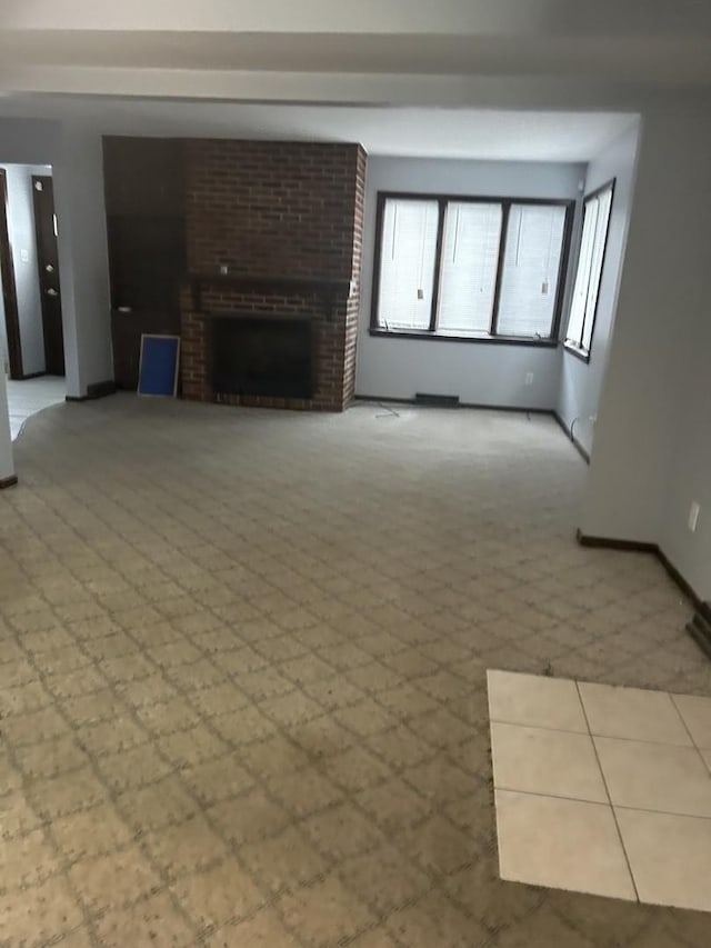 621 Superior Ave, Calumet City, IL 60409 - unfurnished living room with carpet floors, a fireplace, and baseboards