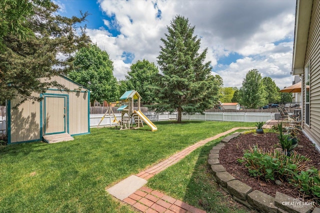 1118 Golden Oaks Pkwy, Aurora, IL 60506 - view of yard featuring a shed, a playground, and an outdoor structure