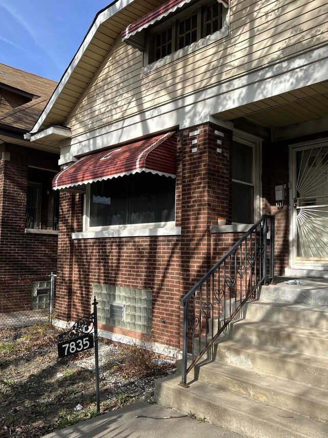 view of property exterior with brick siding