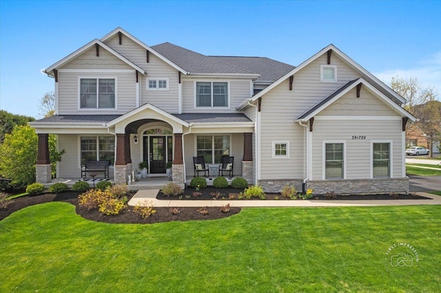 39W729 N Hathaway Ln, Geneva, IL 60134 - craftsman-style home featuring a porch, a front yard, and stone siding