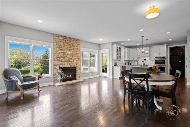 39W729 N Hathaway Ln, Geneva, IL 60134 - dining room with a stone fireplace, recessed lighting, dark wood finished floors, and baseboards