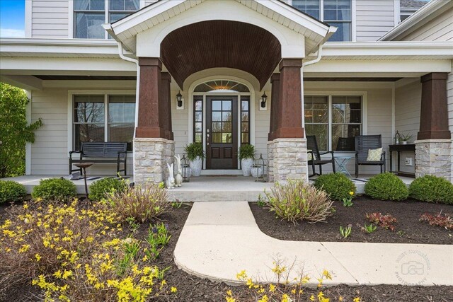 39W729 N Hathaway Ln, Geneva, IL 60134 - view of exterior entry featuring a porch and stone siding