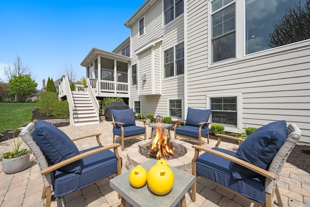 39W729 N Hathaway Ln, Geneva, IL 60134 - view of patio / terrace with a wooden deck, a sunroom, a fire pit, and stairway