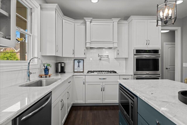 39W729 N Hathaway Ln, Geneva, IL 60134 - kitchen featuring light stone counters, a sink, appliances with stainless steel finishes, and white cabinets