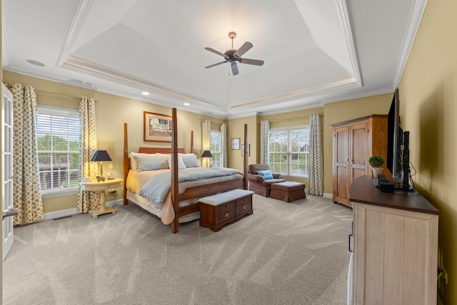 bedroom with a raised ceiling, light carpet, baseboards, crown molding, and recessed lighting