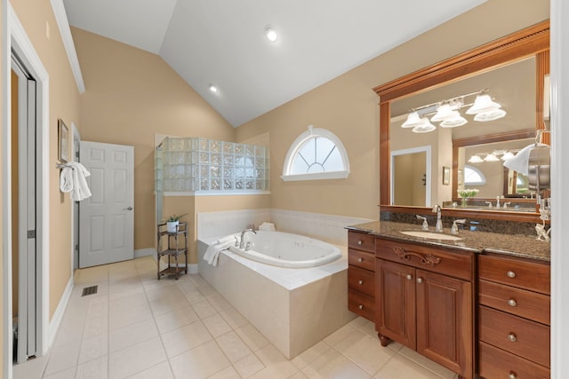 bathroom featuring a bath, vaulted ceiling, vanity, tile patterned floors, and a chandelier