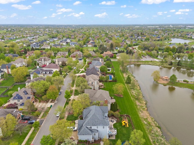 aerial view of residential area with a nearby body of water