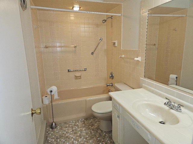 full bathroom featuring toilet, vanity, shower / bathtub combination, and tile patterned floors