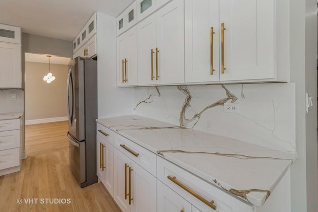 1188 Parkview Ct, Carol Stream, IL 60188 - kitchen featuring freestanding refrigerator, light wood-style floors, light stone countertops, and white cabinets