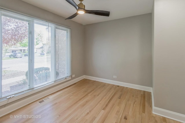 1188 Parkview Ct, Carol Stream, IL 60188 - spare room featuring baseboards, a healthy amount of sunlight, and light wood-type flooring