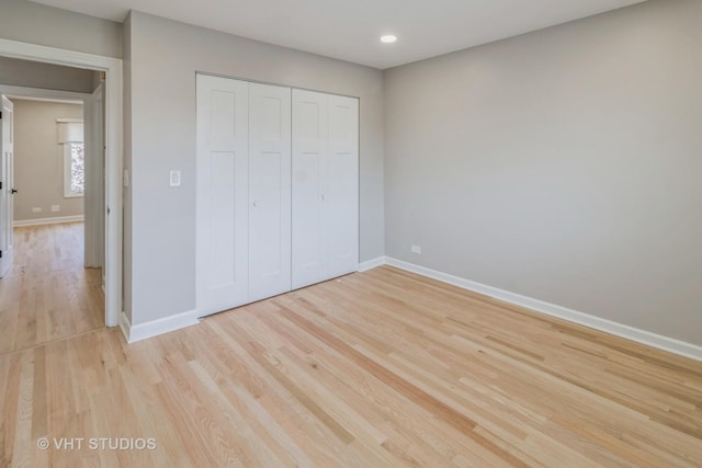 1188 Parkview Ct, Carol Stream, IL 60188 - unfurnished bedroom featuring light wood-style flooring, baseboards, a closet, and recessed lighting