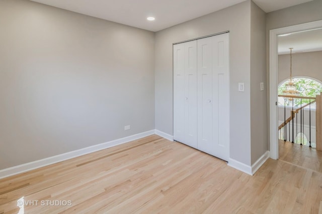 1188 Parkview Ct, Carol Stream, IL 60188 - unfurnished bedroom featuring recessed lighting, baseboards, a closet, and wood finished floors