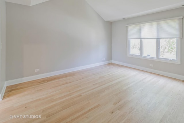 1188 Parkview Ct, Carol Stream, IL 60188 - spare room featuring baseboards, light wood-style floors, and vaulted ceiling